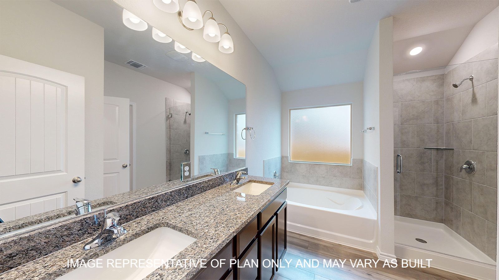 Everett primary bathroom with dark cabinet and granite countertops.