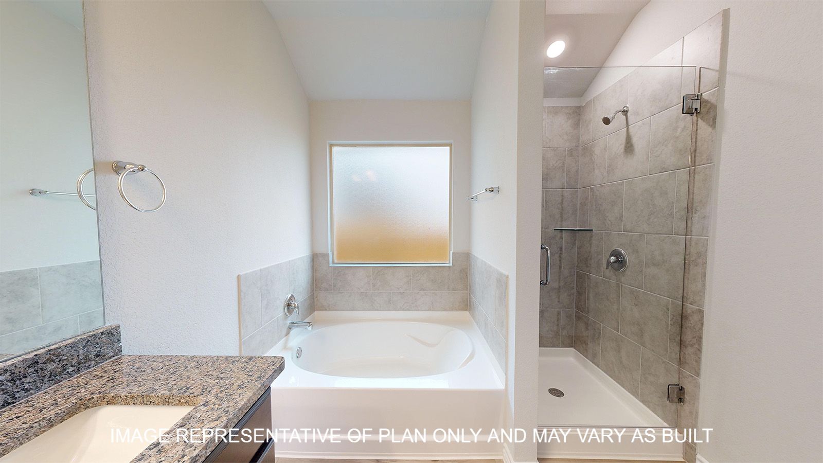 Everett primary bathroom with separate tub and shower.