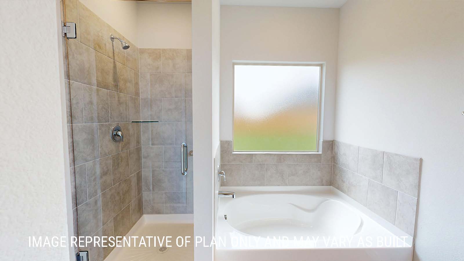 Sonoma primary bathroom with walk-in shower and garden tub with window for lighting.