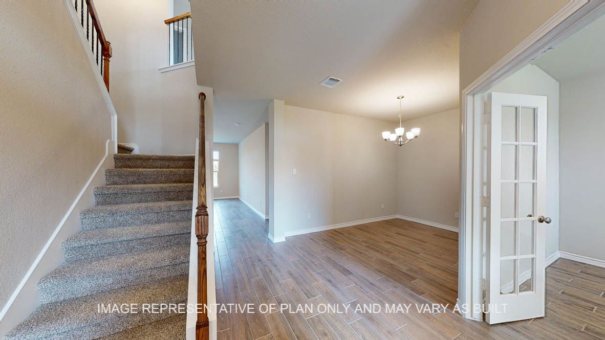 Kiawa entry with view of stairs, formal dining and study.