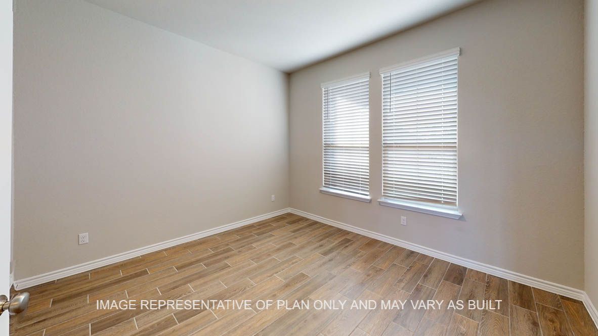 Kiawa study with vinyl plank flooring and window.