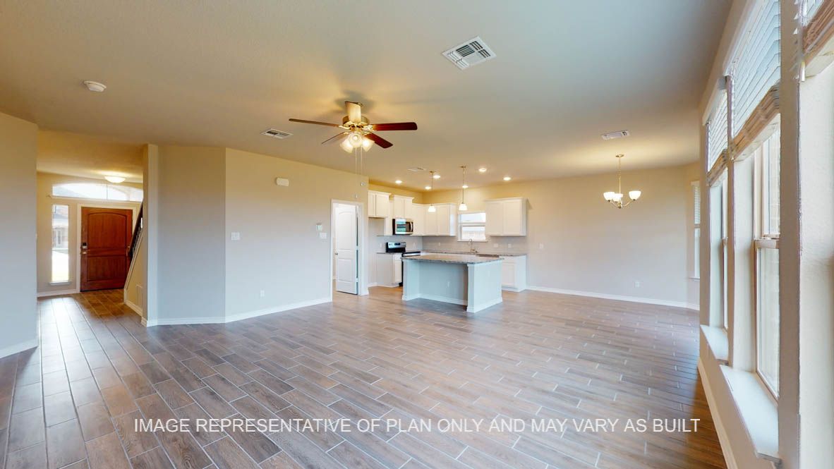 Kiawa living room with view into open kitchen breakfast nook.