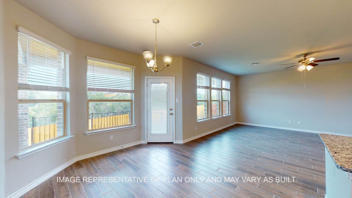 Kiawa breakfast nook with bay windows and light fixture.