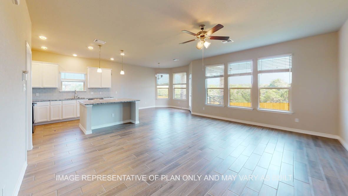 Kiawa living room with view into open kitchen breakfast nook.