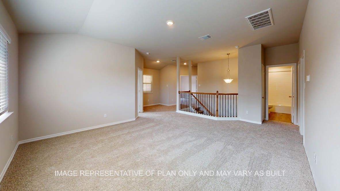 Kiawa game room with half wall railing to the stairs.