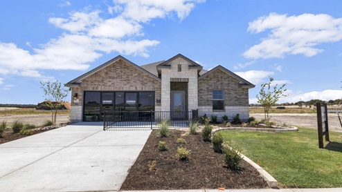 Warrior's Legacy model home exterior elevation with glass store front windows.