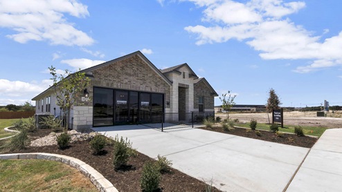 Warrior's Legacy model home exterior elevation with glass store front windows.