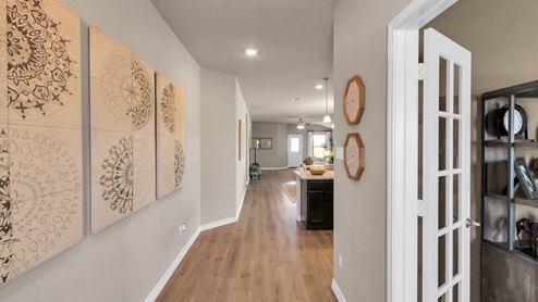 Warrior's Legacy model home front entry with view of the kitchen.