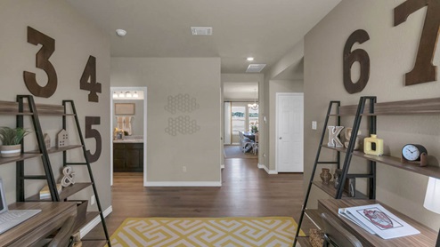 Warrior's Legacy model home common area with view of the secondary bathroom and dining room.
