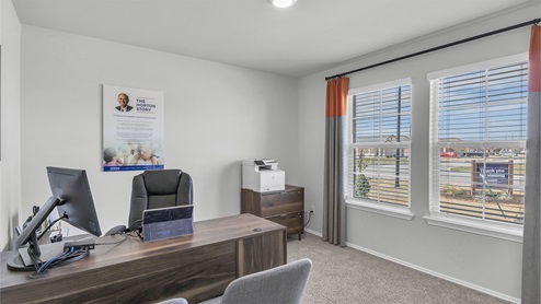 Lake Pointe Terrace secondary bedroom with carpeted flooring and view of backyard.