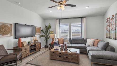Lake Pointe Terrace open concept living room with windows view of backyard.