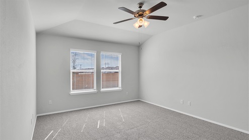 Lake Pointe Terrace primary bedroom with carpeted flooring and double windows.