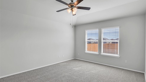 Lake Pointe Terrace primary bedroom with carpeted flooring and double windows.
