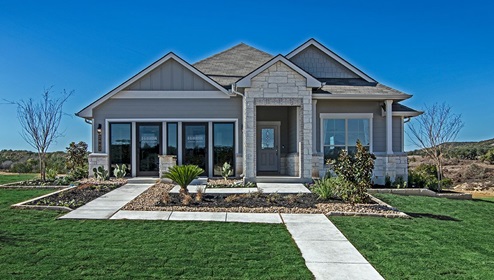 Creekside Hills model home exterior with glass store front doors.