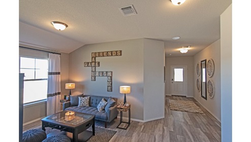 Creekside Hills model home game room open to the entry hallway.