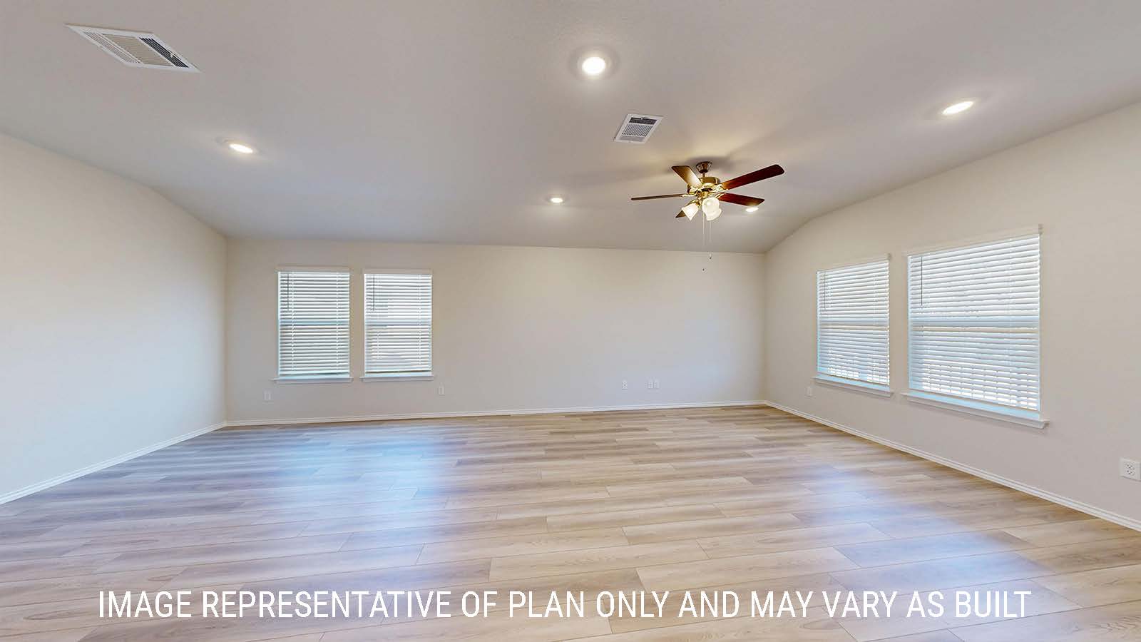 Caden living room with vinyl plank flooring and windows for natural lighting.