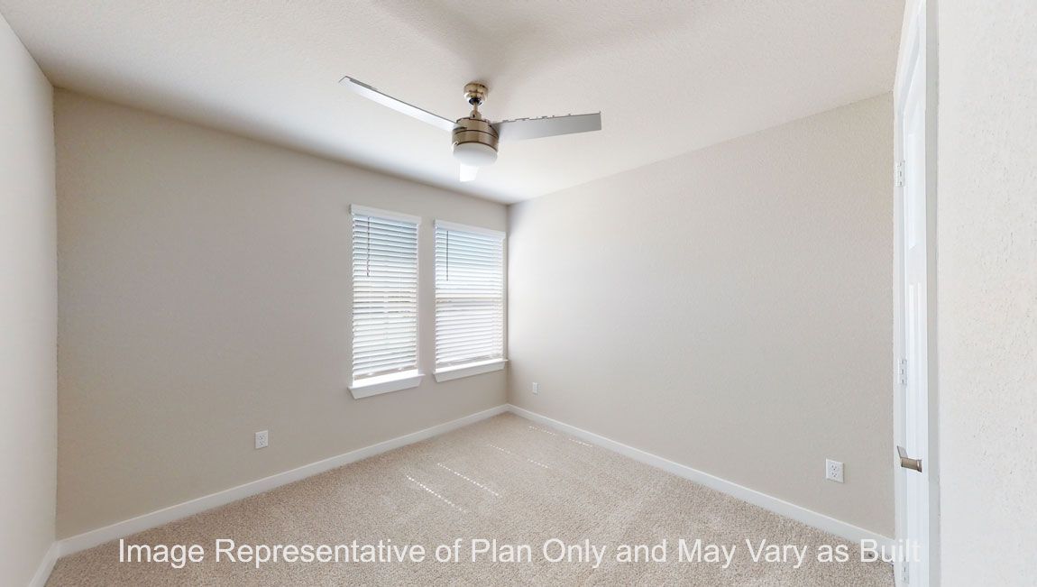 Harris primary bedroom with carpet flooring and window.