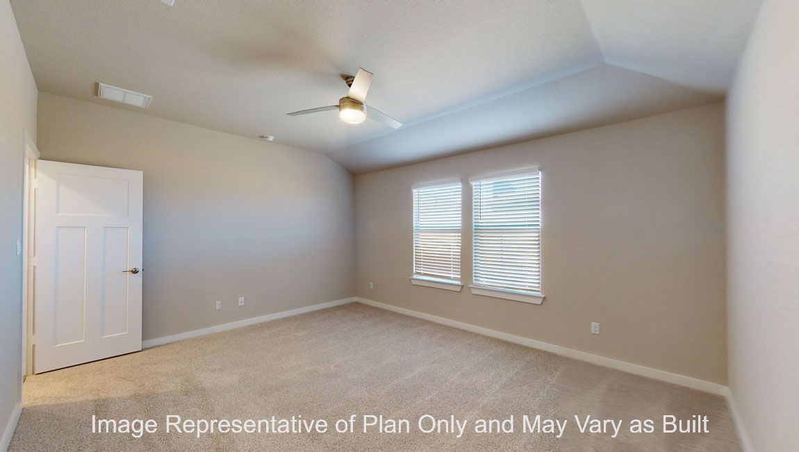Harris secondary bedroom with carpet flooring and window.