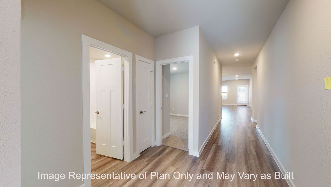 Harris entry with view to living room, entry closet and secondary bedroom.