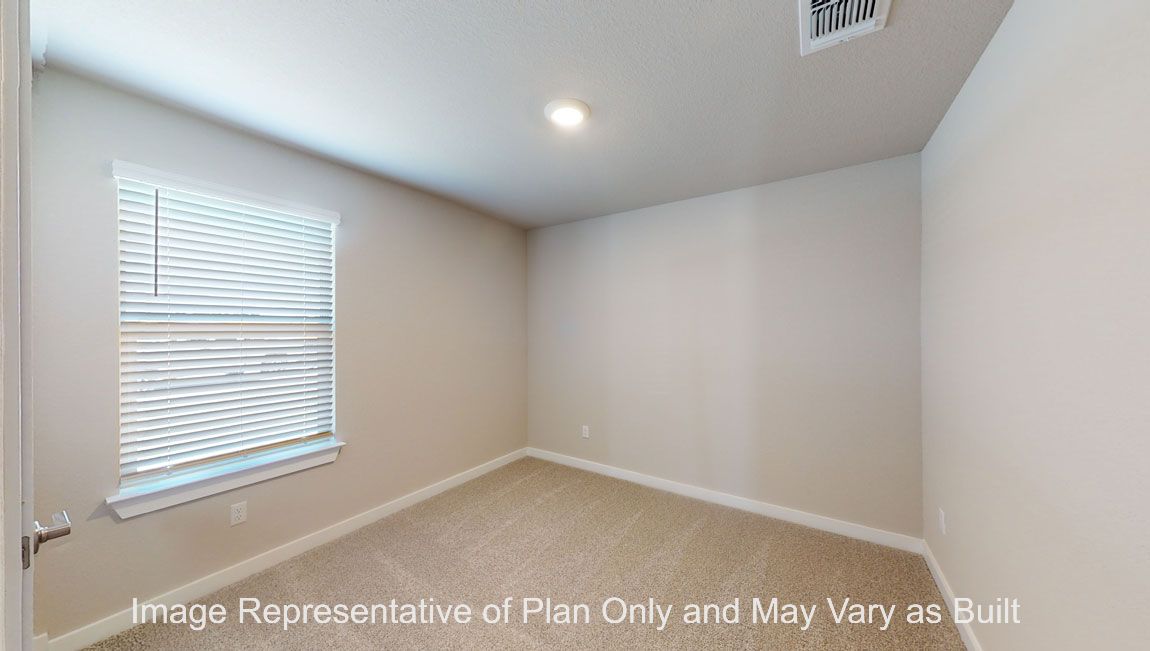 Harris primary bedroom with carpet flooring and window.