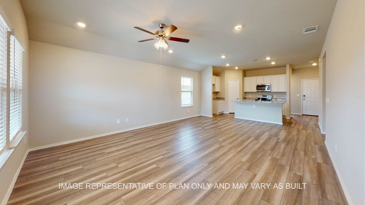 Elgin living room with view into open kitchen concept layout.