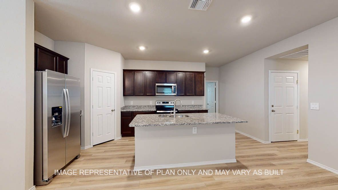 Camden kitchen with dark cabinets and granite countertops.