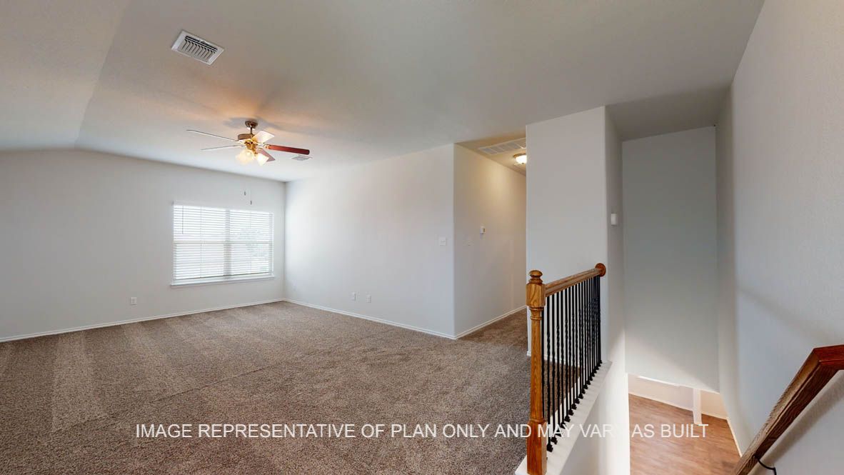Aspen upstairs game room with carpet flooring.