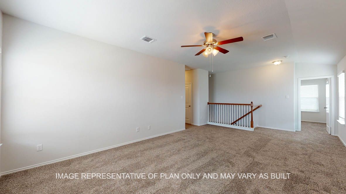 Aspen upstairs game room with carpet flooring.
