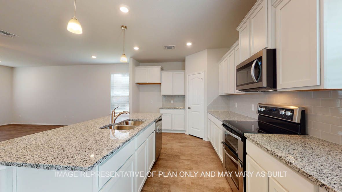 Aspen kitchen with corner pantry and stainless appliances.