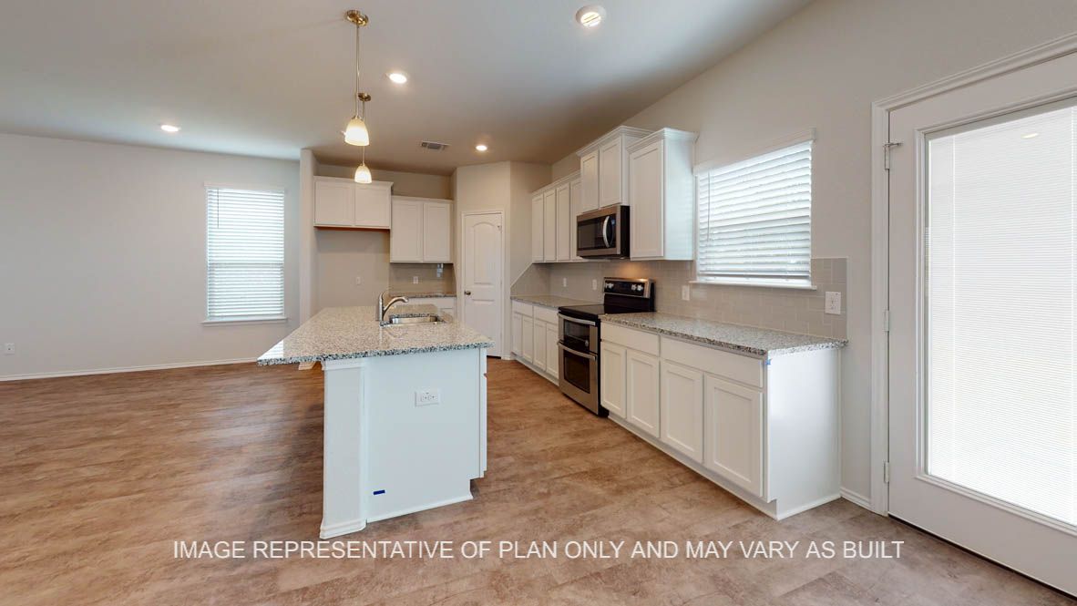 Aspen kitchen with corner pantry and stainless appliances.