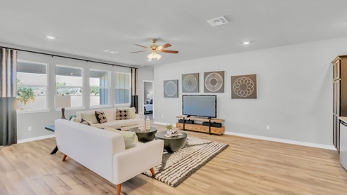 Village at Nolan Heights model home living room with a view of master bedroom.