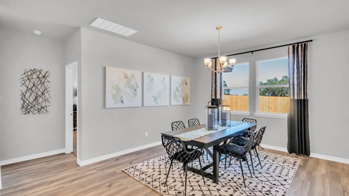 Village at Nolan Heights model home dining room with a view of the backyard.