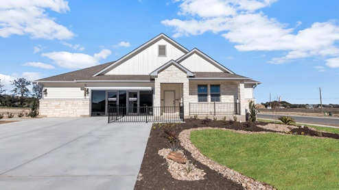 Village at Nolan Heights model home exterior elevation with glass store front windows.