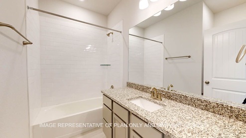 Parker secondary bath with tub and shower combination.