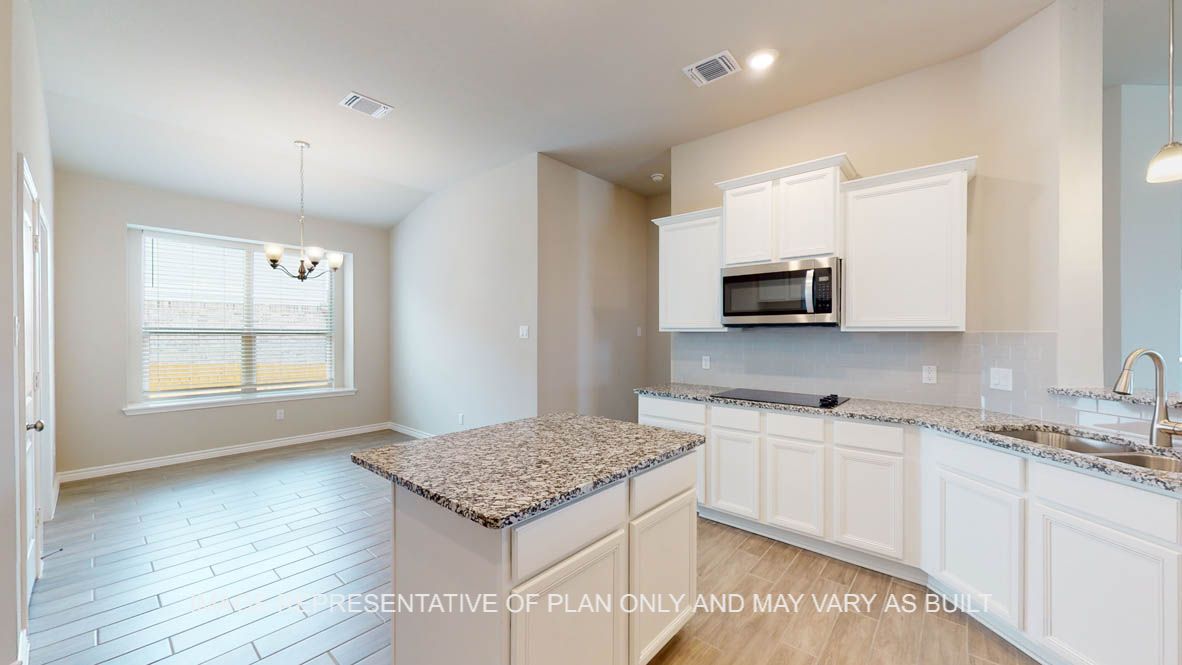 Sierra kitchen with center kitchen island and granite countertops.