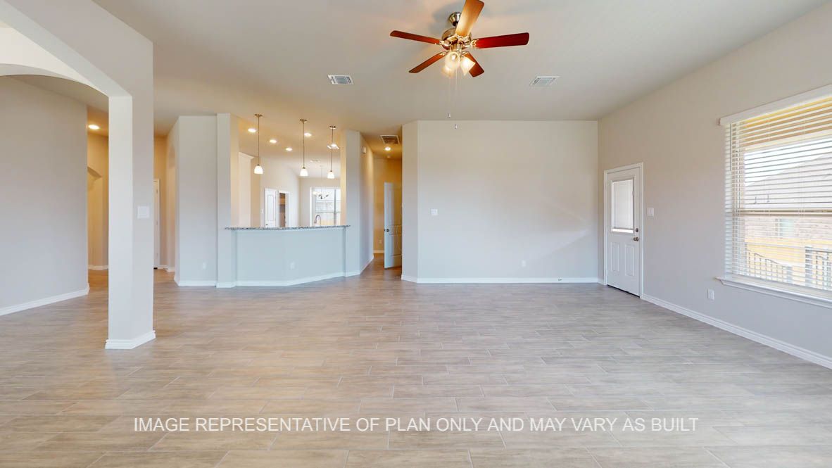 Sierra open living and formal dining room space and raised bar top looking into kitchen.