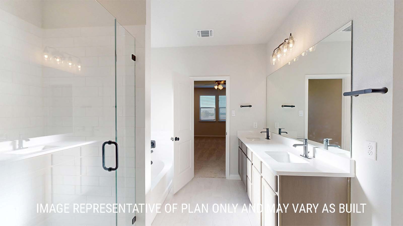 Parker II primary bathroom with duel vanity with granite countertops an walk-in shower.