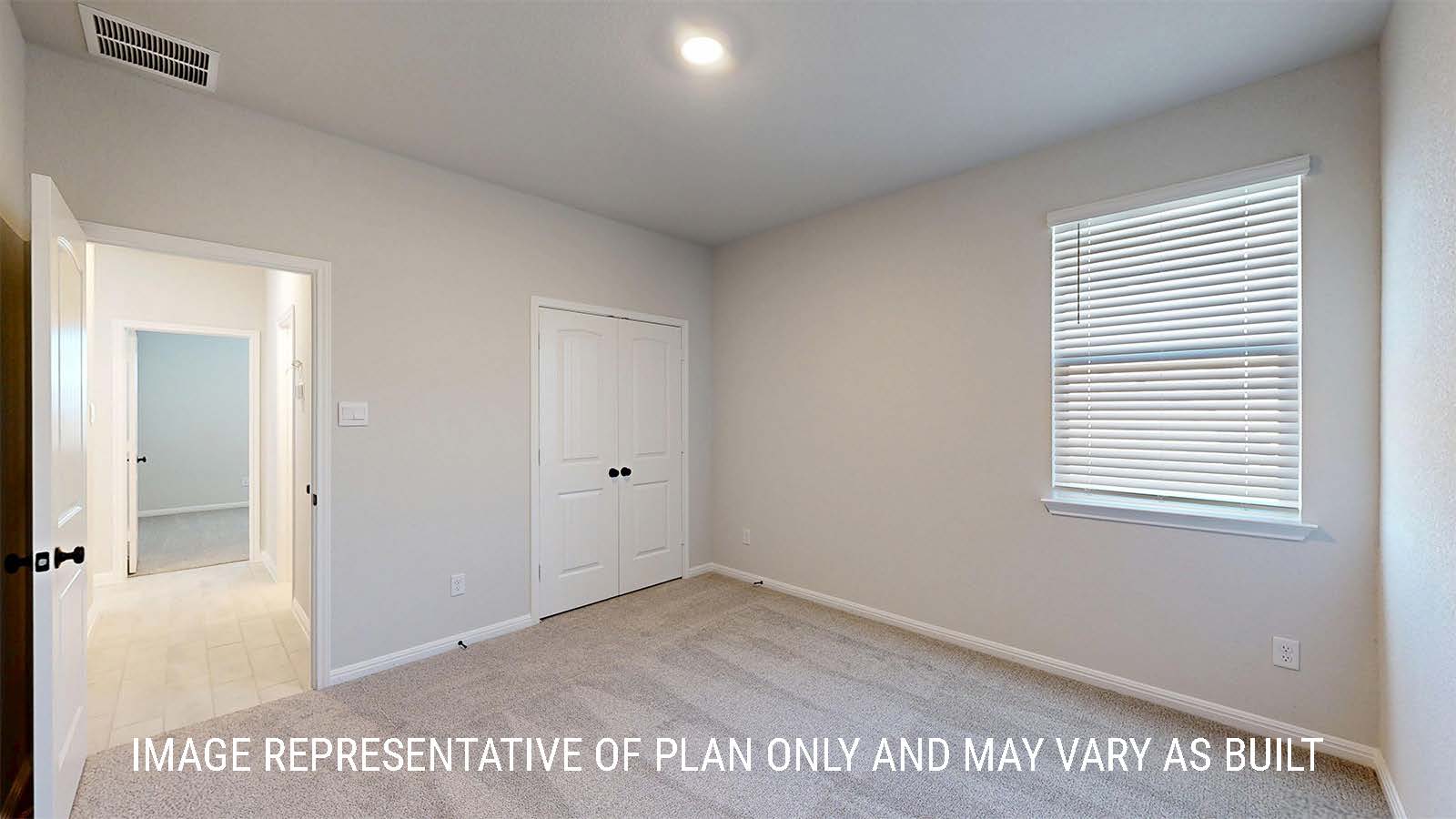 Parker II secondary bedroom with carpeted flooring and window.