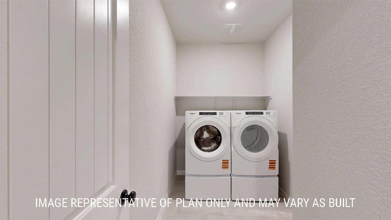 Parker II utility room with washer and dryer and shelving for storage.