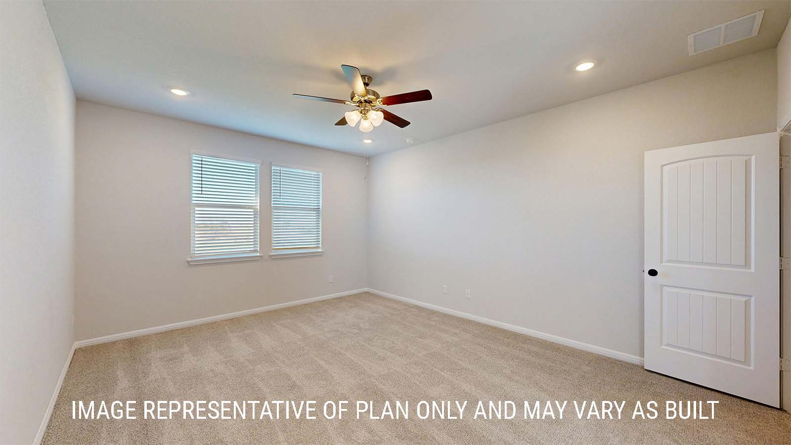Parker II primary bedroom with carpeted flooring and windows for natural lighting.