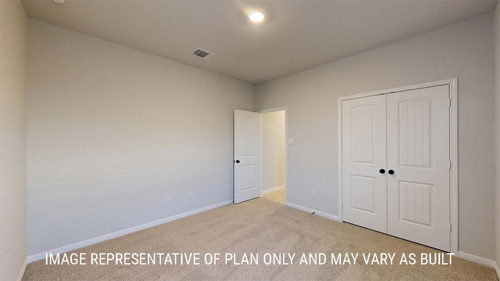 Parker II secondary bedroom with carpeted flooring and view of closet.