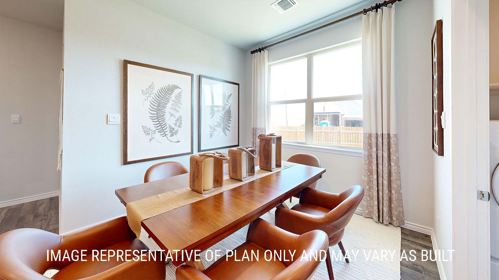 Newburgh dining room with windows for lighting and view of back yard.