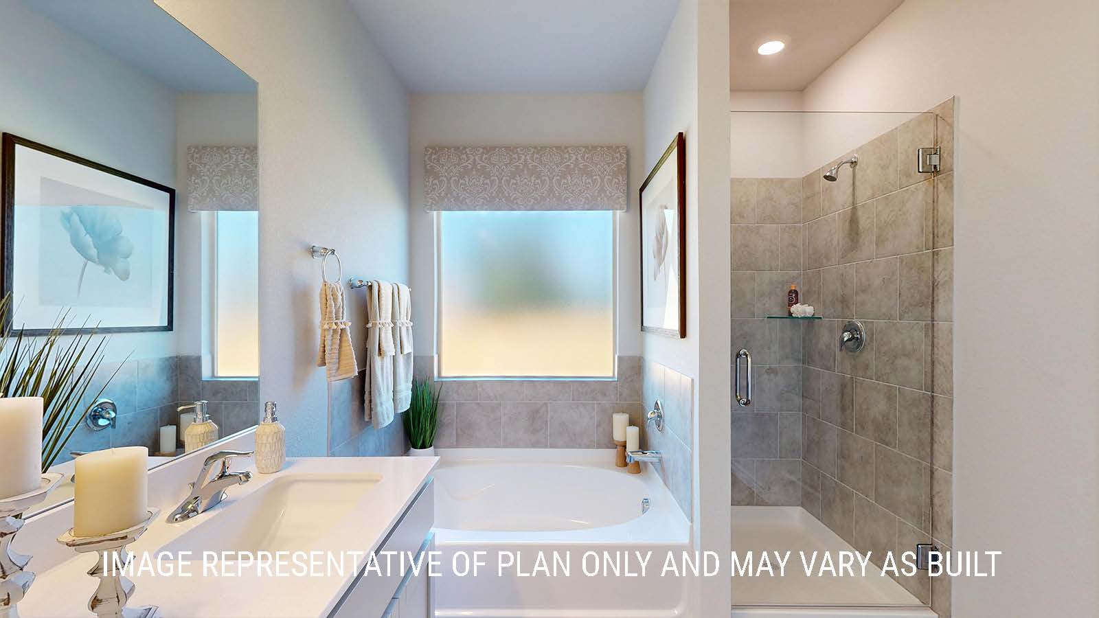 Newburgh primary bathroom with garden tub and walk-in shower.