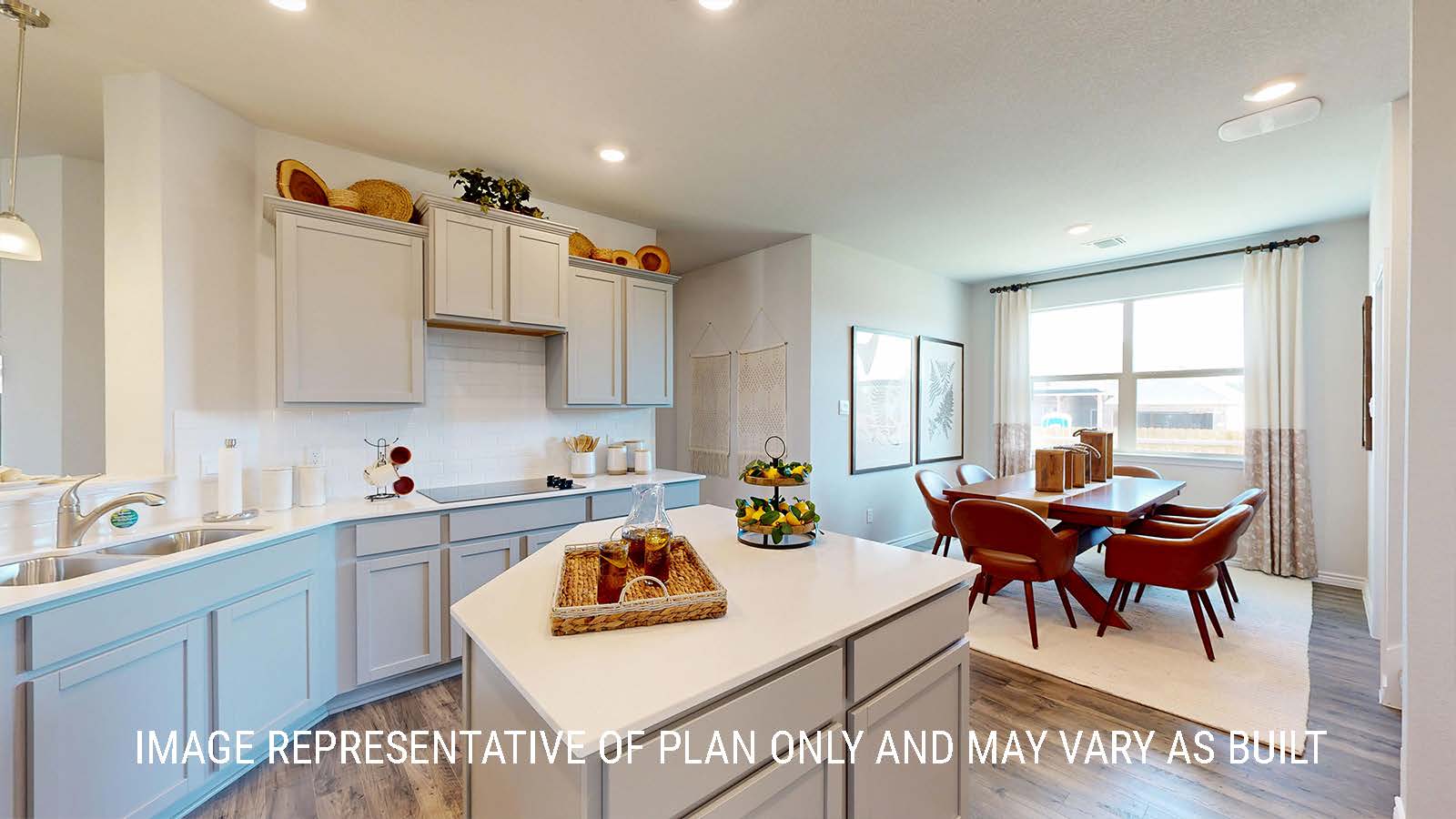 Newburgh kitchen with center kitchen island and view dining room.