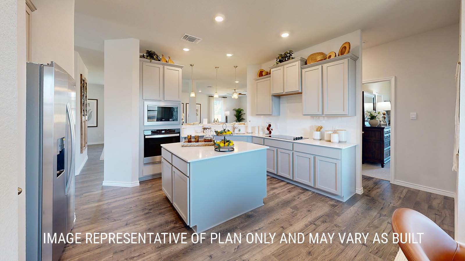 Newburgh kitchen with center kitchen island and light cabinets and granite countertops.
