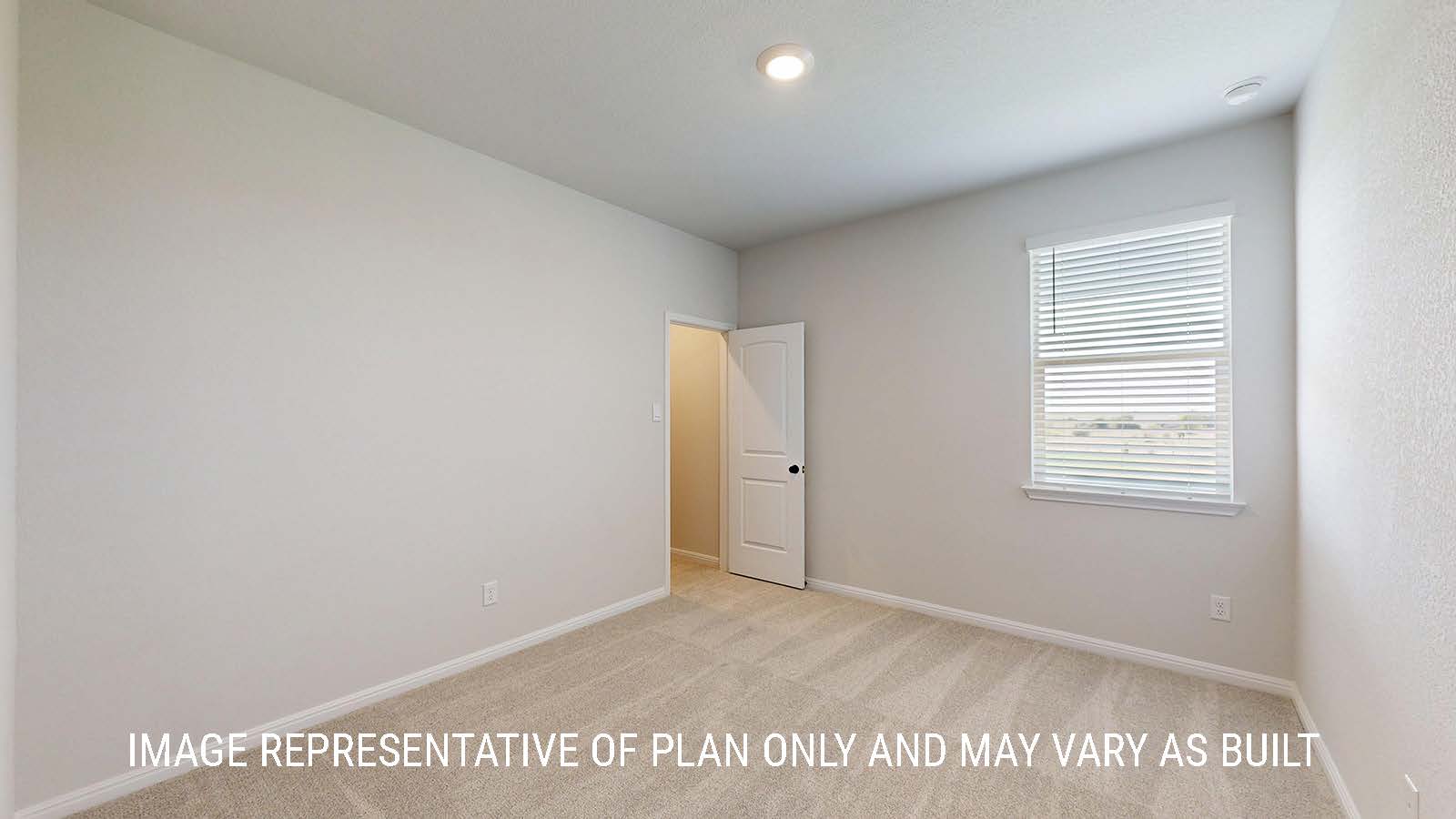 Waverley secondary bedroom with carpeted flooring and window for lighting.