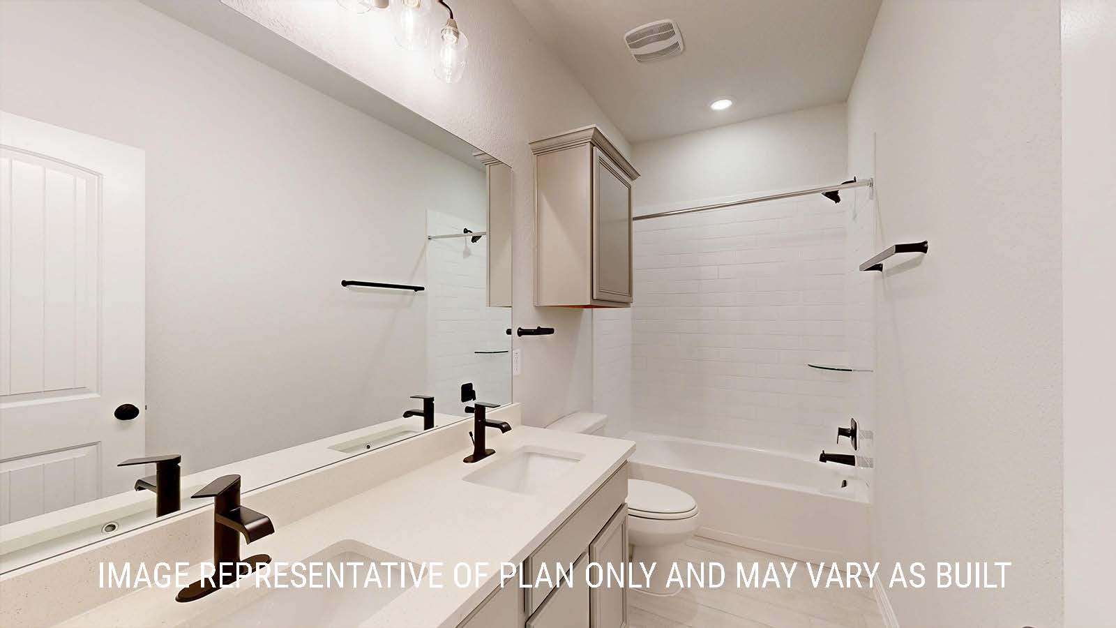 Waverley secondary bathroom with duel vanity sinks and shower and tub combo.