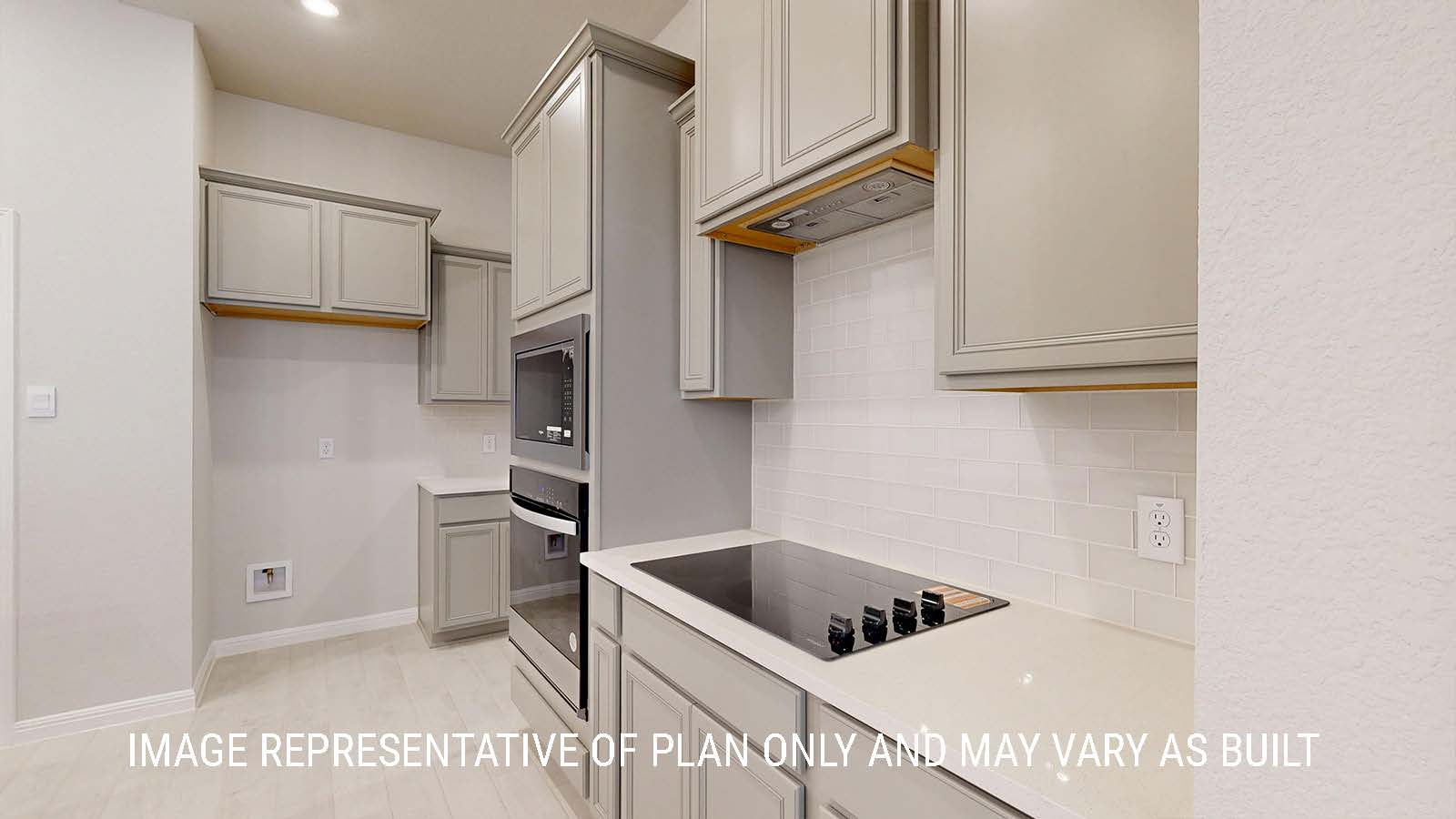 Waverly kitchen with light cabinets and granite countertops.