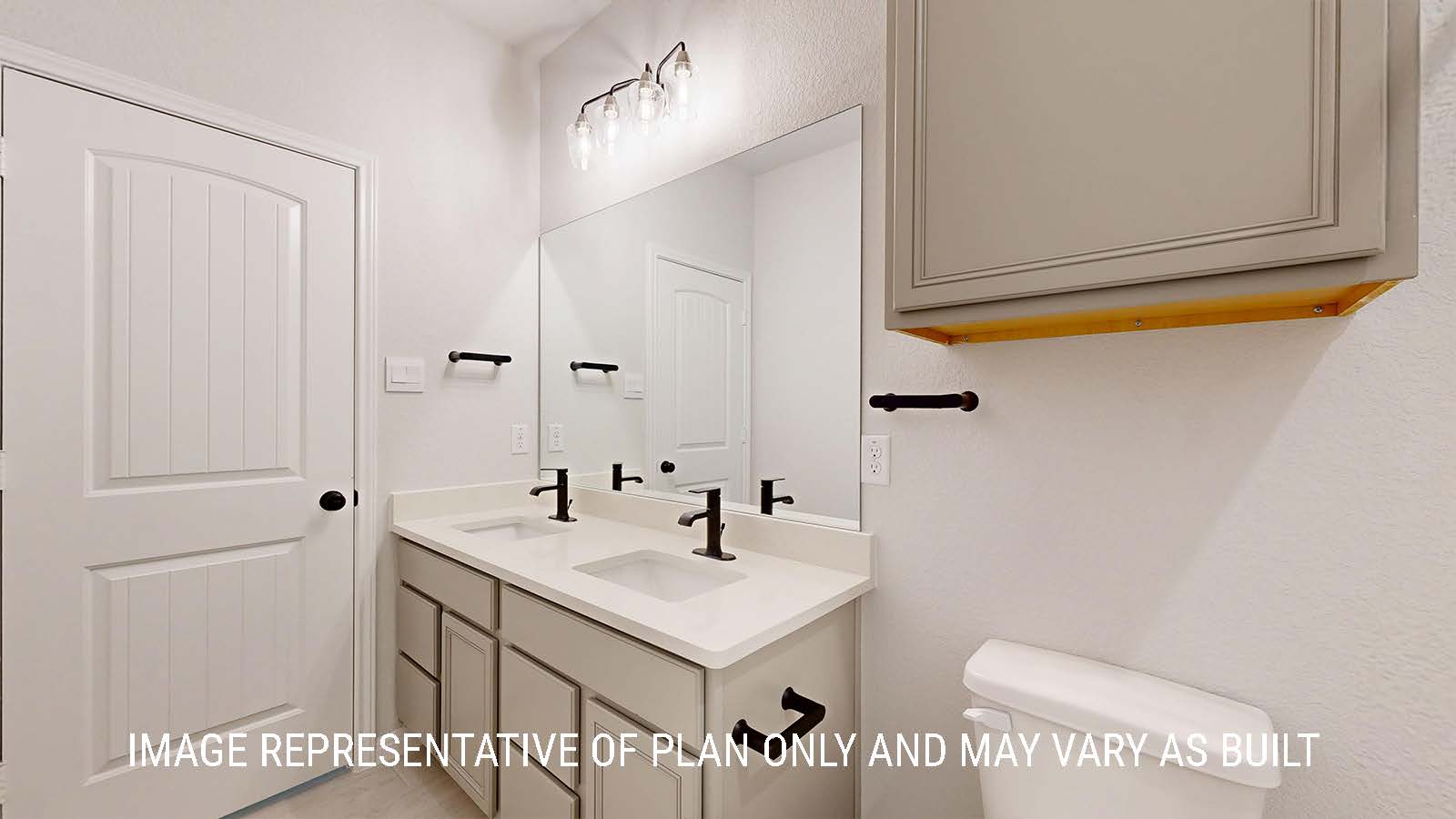 Waverley secondary bathroom with duel vanity sink and light cabinets and granite countertops.