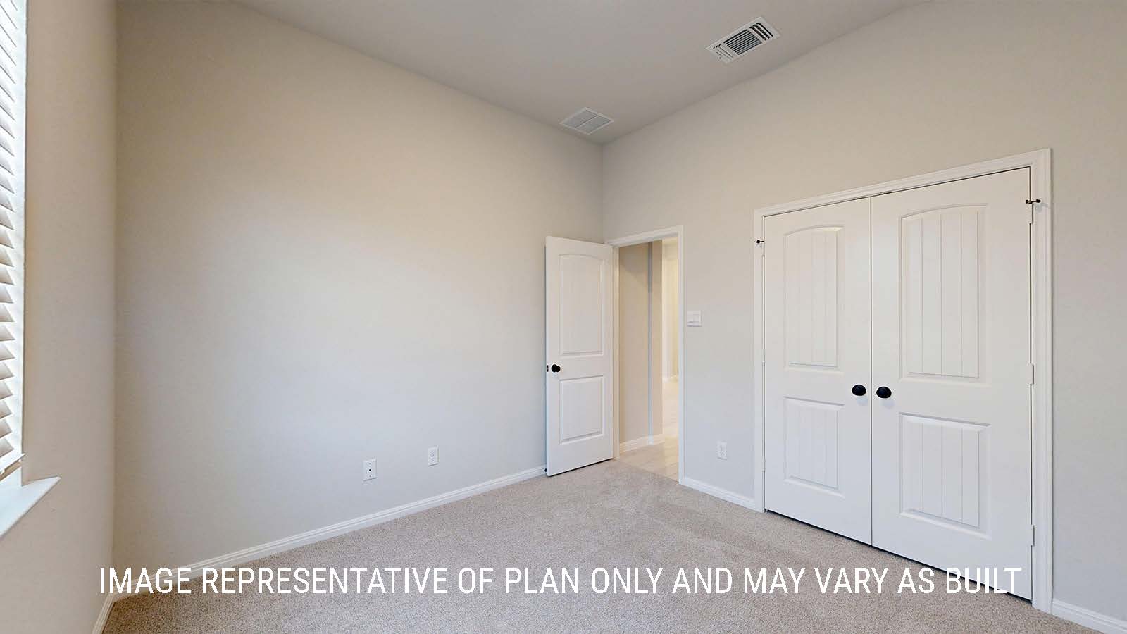 Waverley secondary bedroom with carpeted flooring and window for lighting.